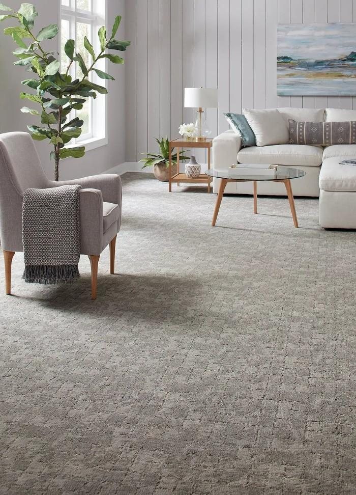 Grey patterned fitted carpet in living room
