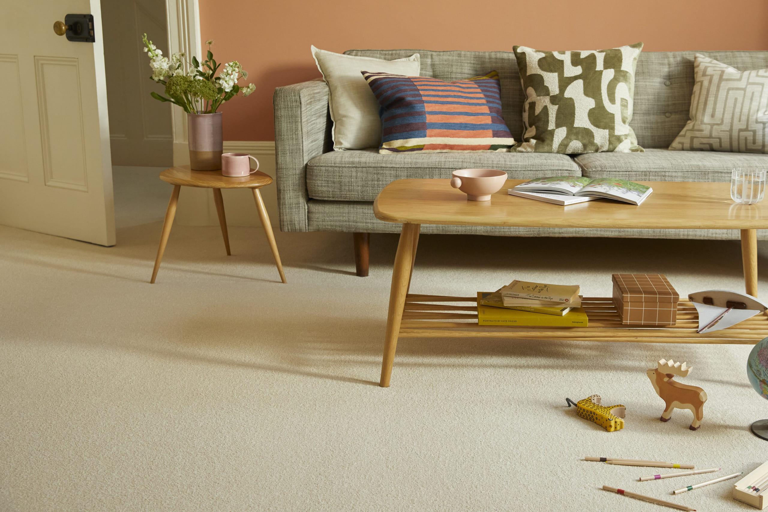 Cream Cormar wool carpet running through a bright family living room