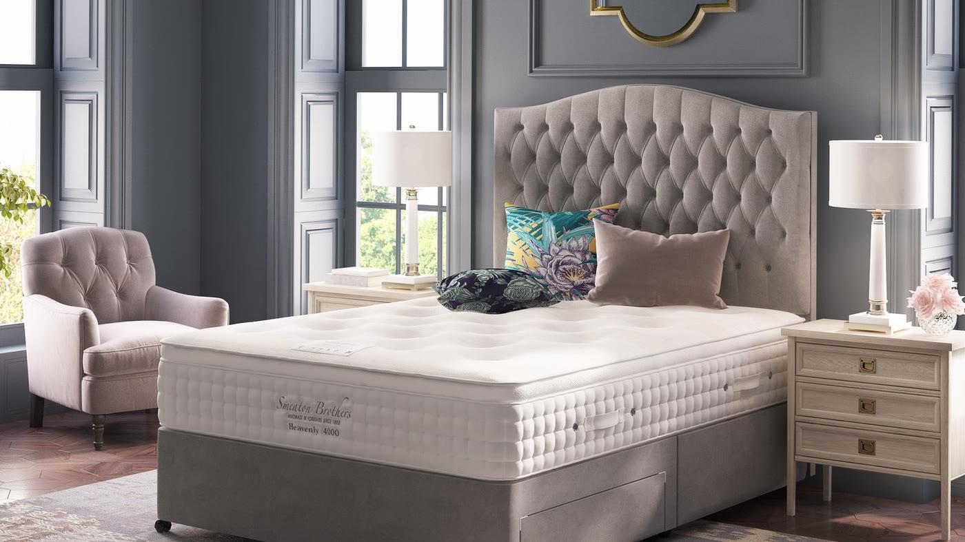A Smeaton Brothers Heavenly 4000 pocket-sprung mattress on a grey divan, in a panelled bedroom with a tall buttoned headboard