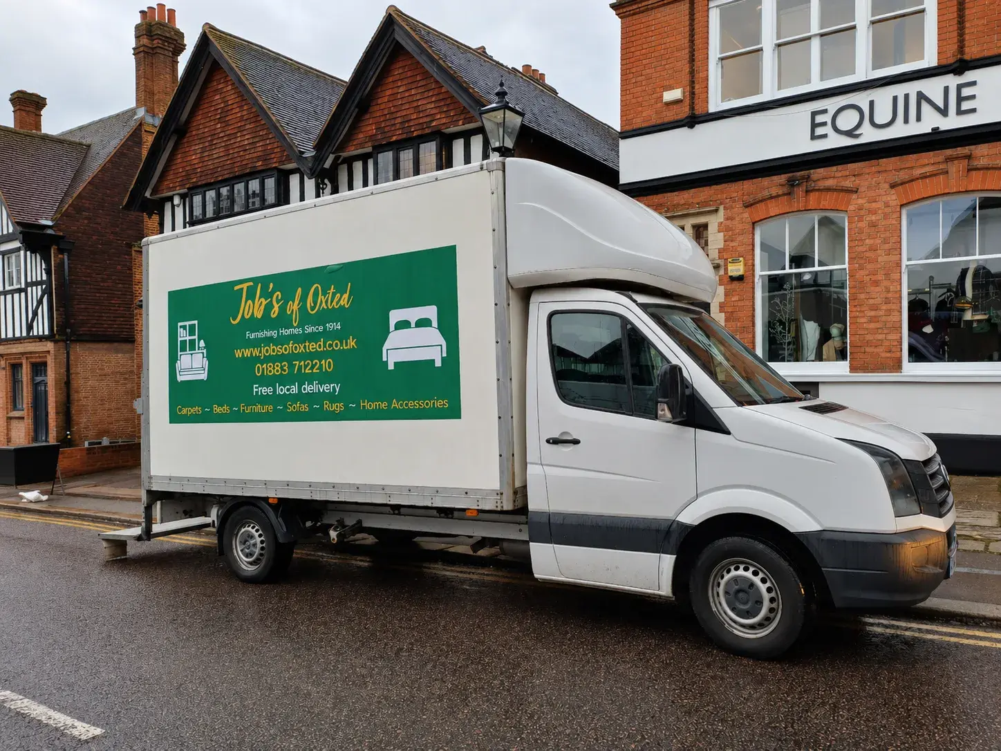 Job's of Oxted delivery van outside the showroom.