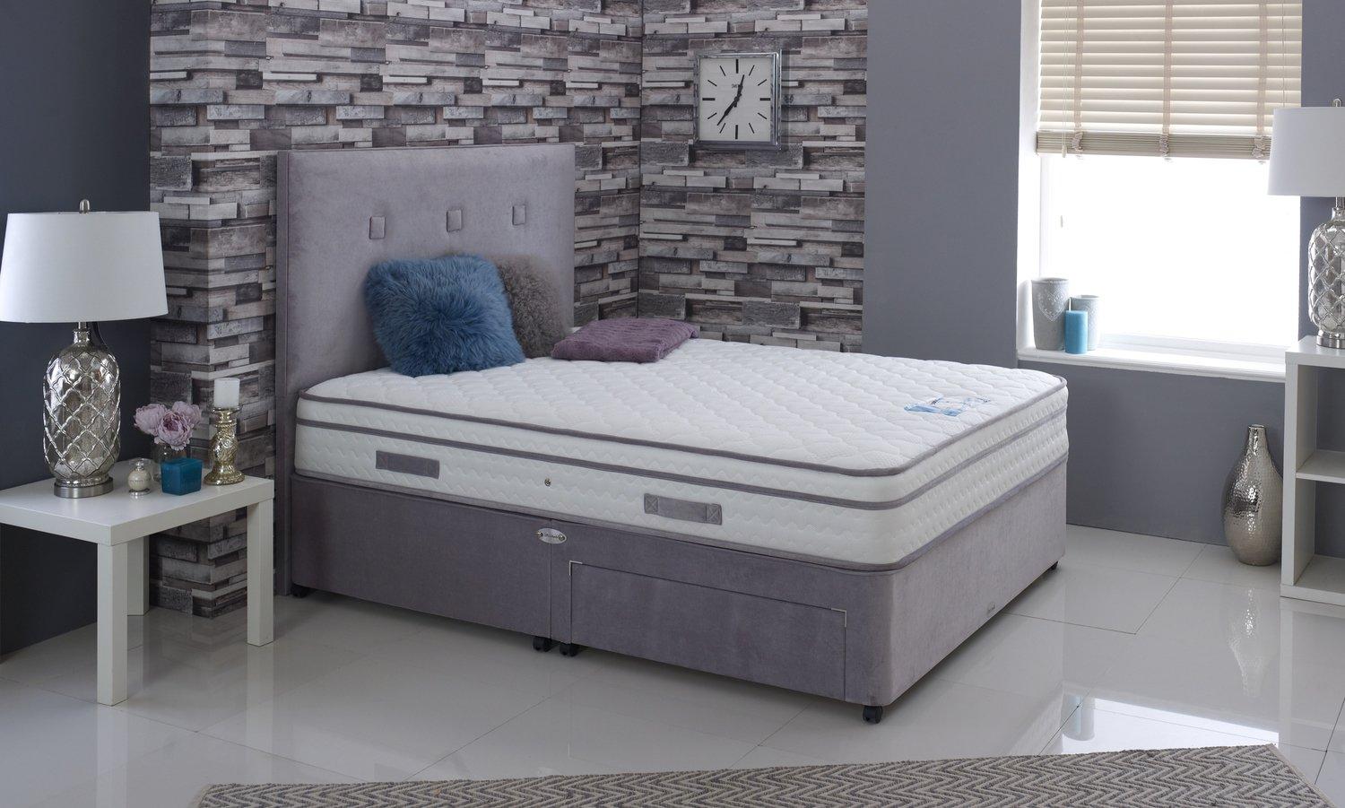 A pocket-sprung mattress on a divan base in a calm, neutral bedroom.