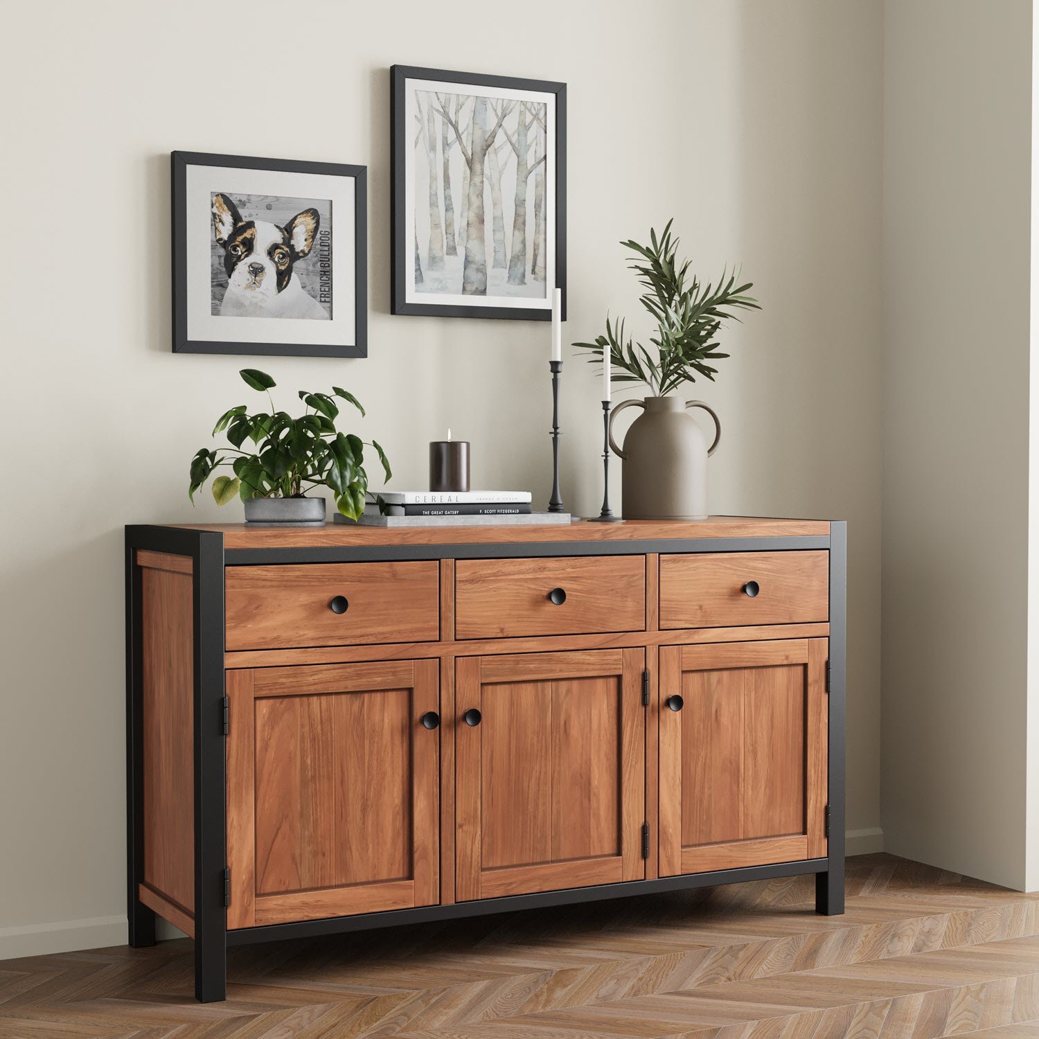 A solid wood sideboard styled with plants and framed prints in a calm, neutral room