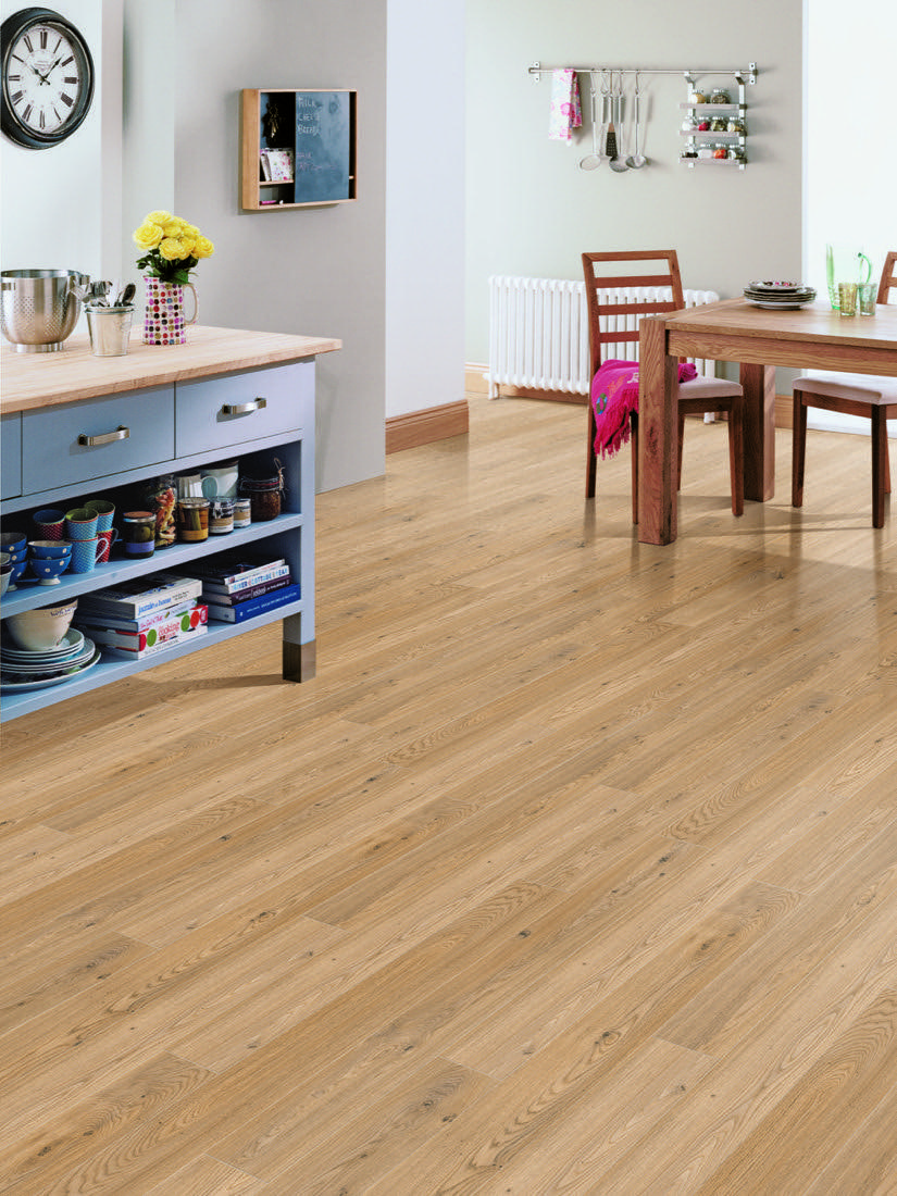 Wood-effect Lifestyle flooring running through a bright open kitchen-diner.